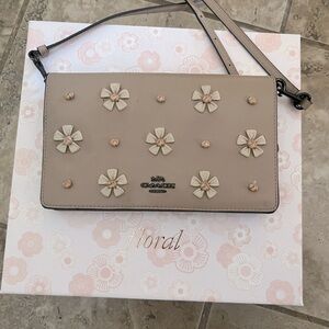 Coach fold over flap clutch purse.